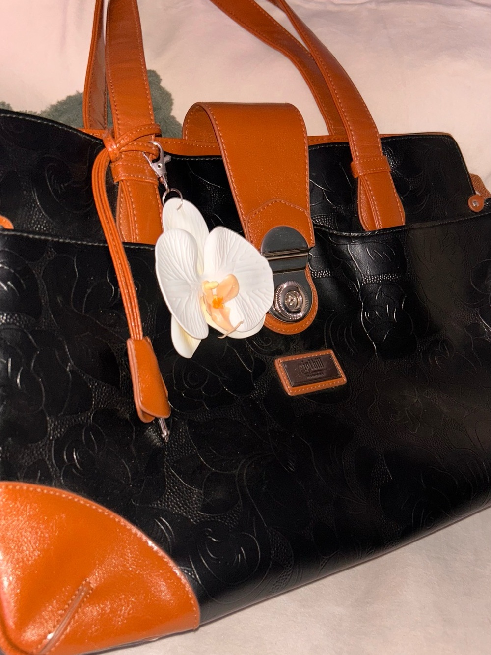 Gigi Hill Two-Tone Black and Brown Leatherette Tote with Floral Charm